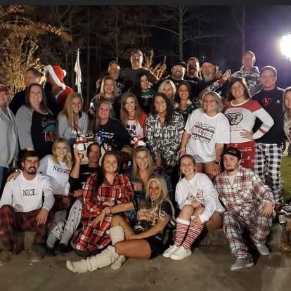 A big holiday crew piled together for the group photo.