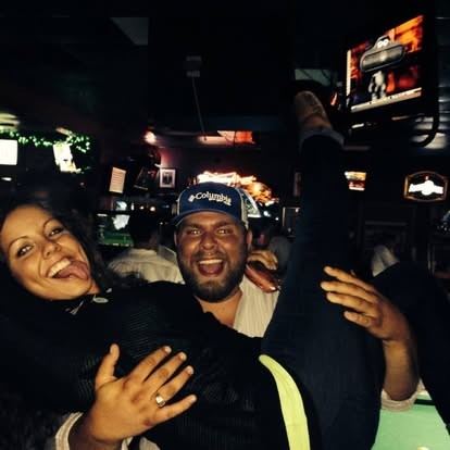 Cracking up while getting hoisted at the bar.