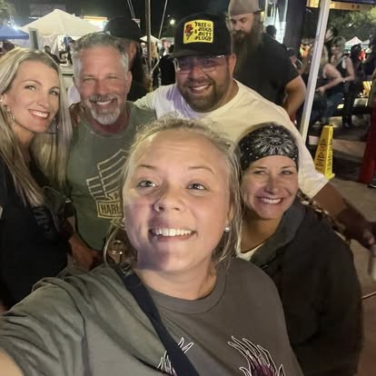 Squeezing in for a happy group selfie one night out.