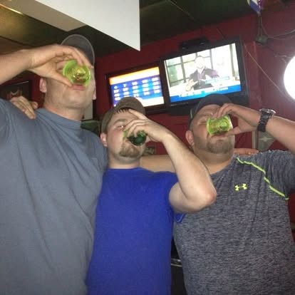 Tipping back shots with the boys at the bar.
