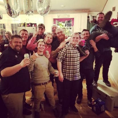 Nate and the whole crew raising a toast together.