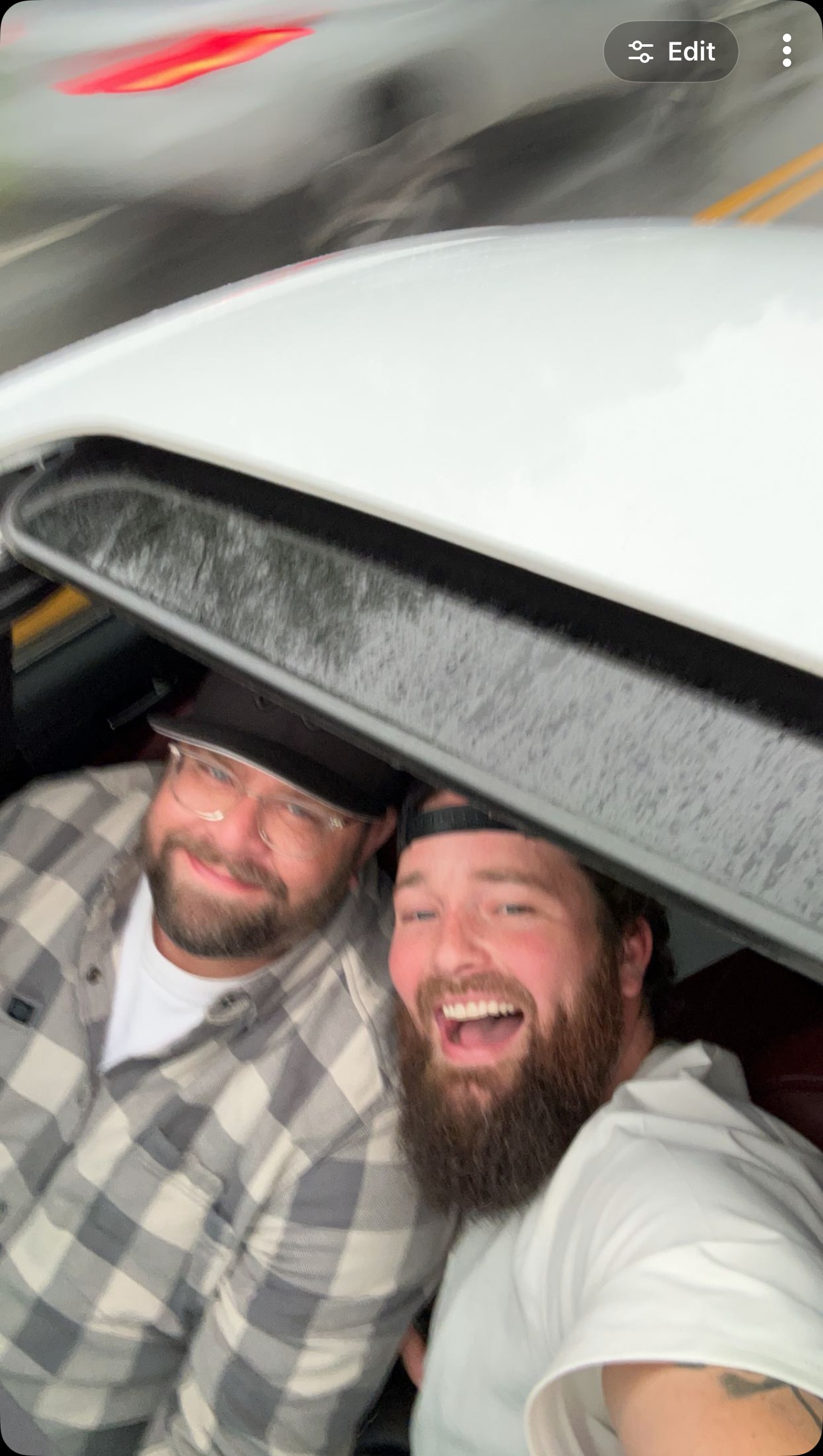 Cracking up together under the hatch, mid-adventure.