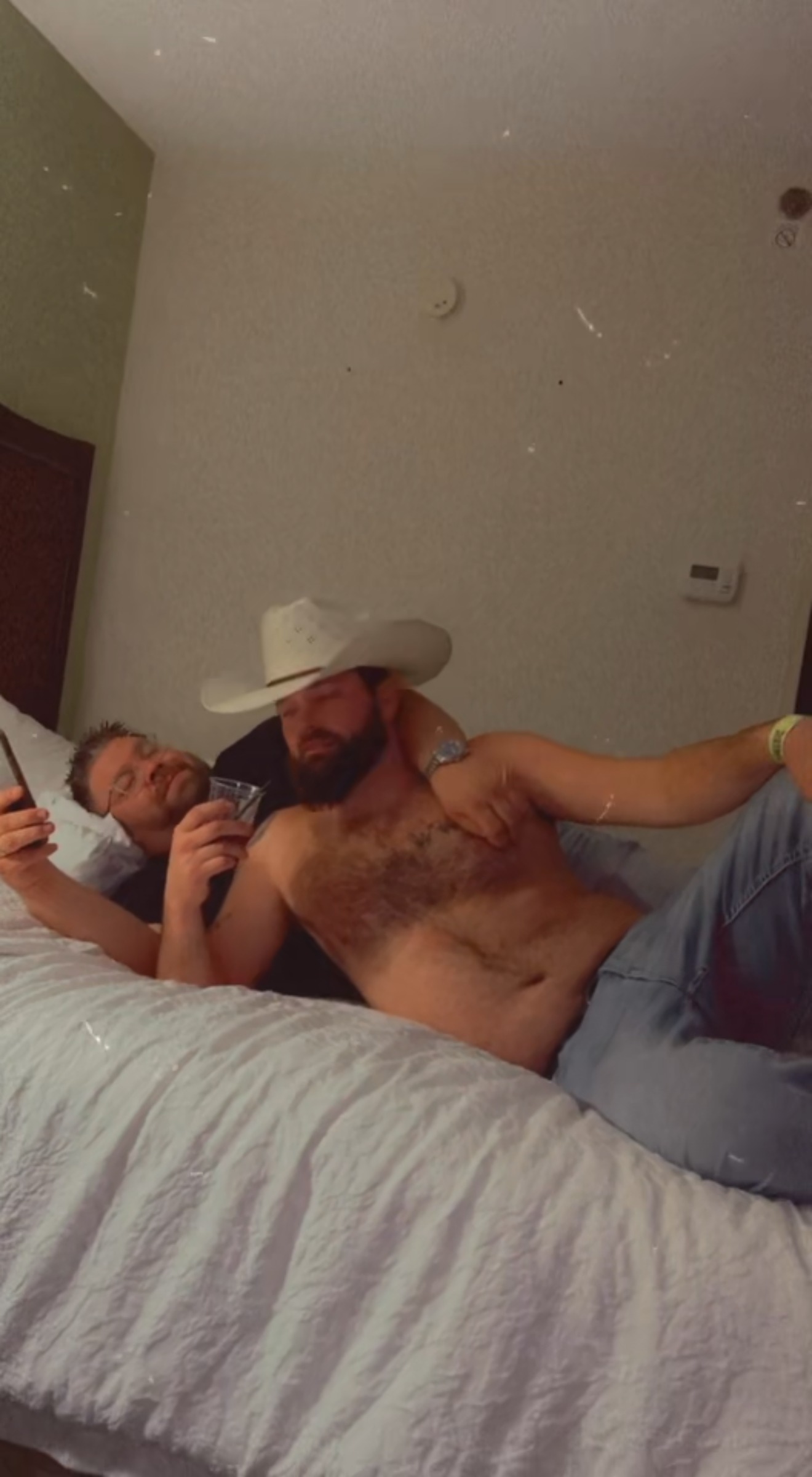 Cowboy-hat kickback — hotel downtime on a boys' trip.