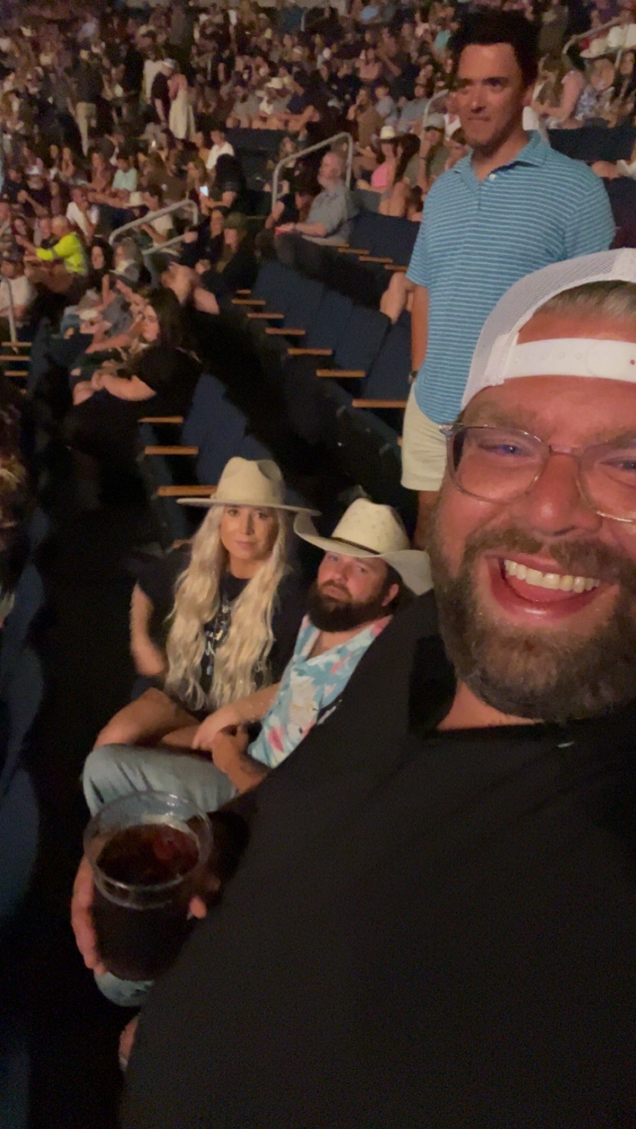 Front-row grins at the country show.