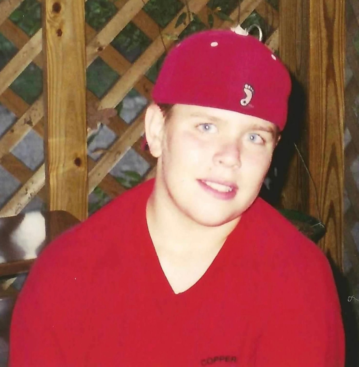 The teenage years — red cap, big grin, all Nate.